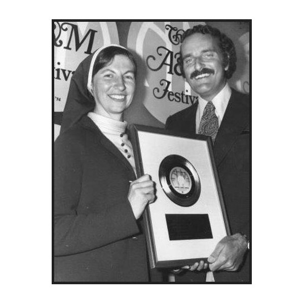 Sister Janet Mead receives her gold copy of The Lord's Prayer when it sold 1 million copies in the United States.