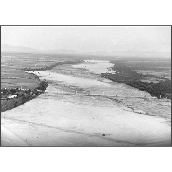 Aerial photograph of Burdekin Bridge construction site showing piers with Railway Bridge in foreground 1952