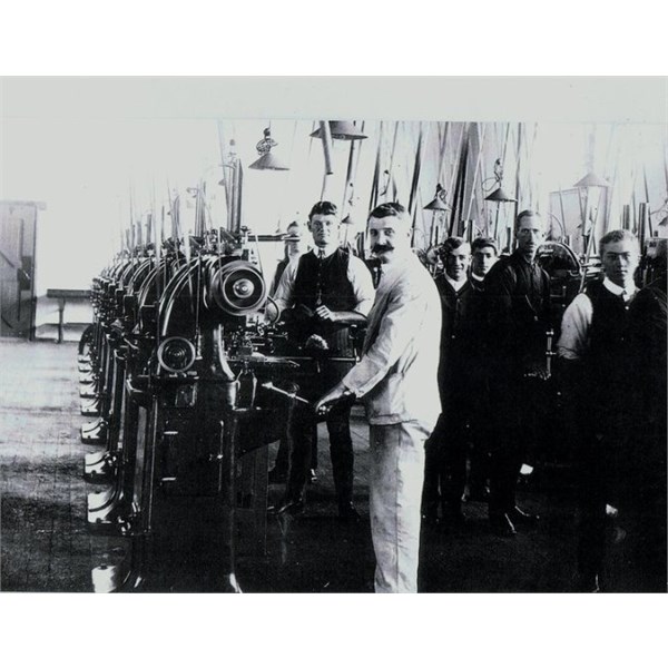 fitters & turners & supervisors preparing the laithes for production on the 303 rifles.