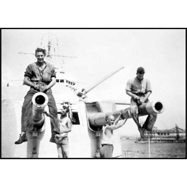 Sailors working on the 6-inch (150 mm) diameter barrels of ''A''  turret following the Battle of Cape Spada in 1940