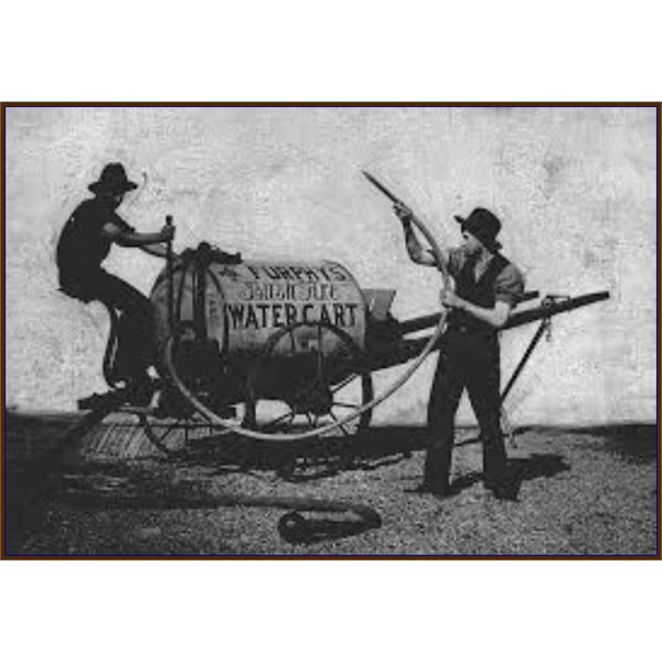 Two men demonstrating Furphy 's bush fire water cart.