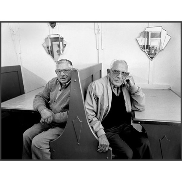 Peter and Jack Veneris sitting at a booth in the Blue