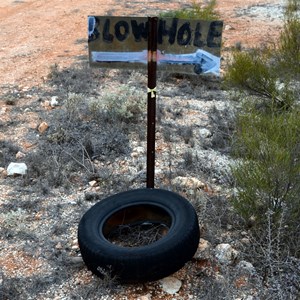 Blow Hole sign on the side of the road