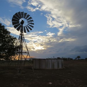 Nearby windmill and tank