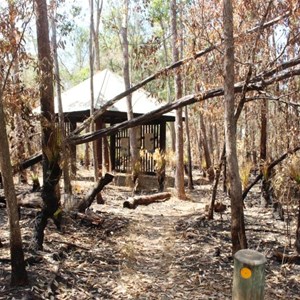 Burned area around information shelter
