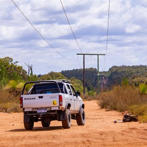 Learner driver using the service track under the powerlines