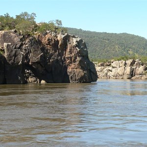 The river rushes between rocky cliffs