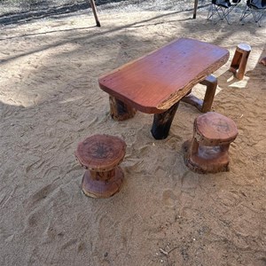 Wooden stools and table in camp kitchen