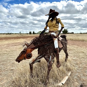 Cutting horse cowgirl and steer sculpture
