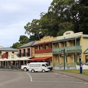 Business premises line the street behind the wharf