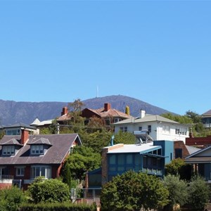 Houses overlook the river with MT Wellington in the background.