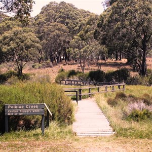 A board walk crosses the stream between the picnic and camping areas